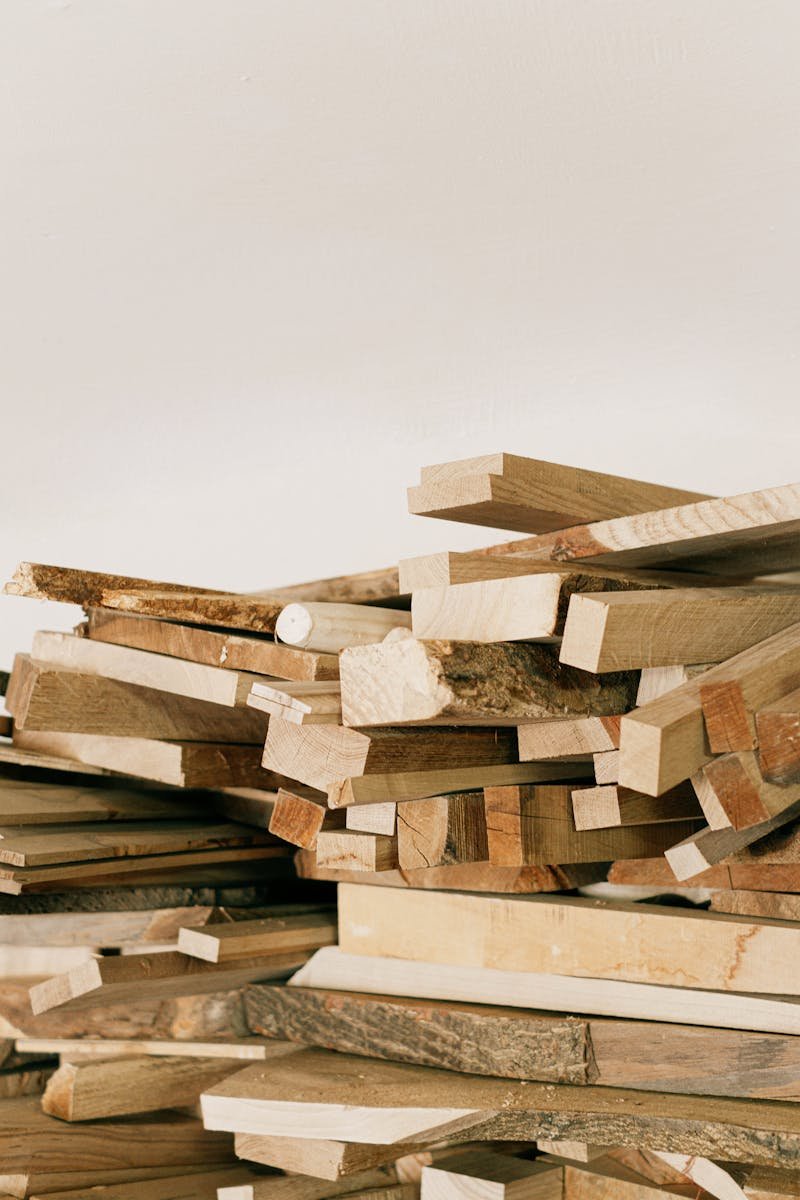 A detailed view of stacked wooden planks ready for crafting and woodworking projects.